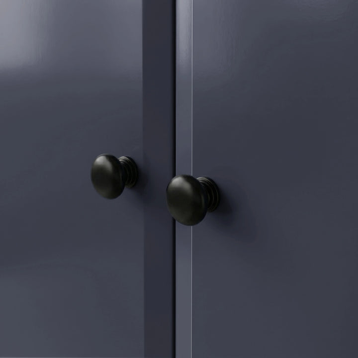 [Blue] Haven wardrobe knob close-up, two round black knobs on smooth blue painted door fronts