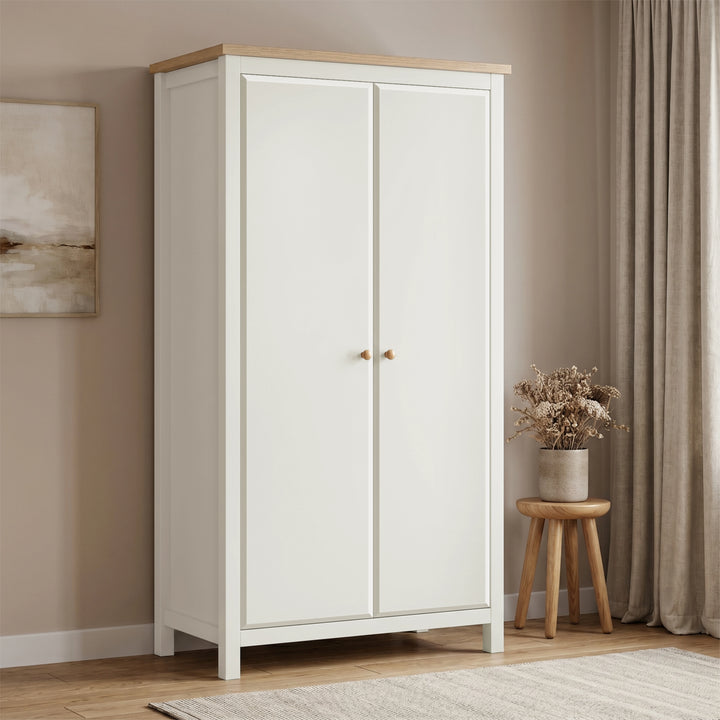 [White] 2 door wardrobe with wooden top in a room with beige walls and curtains