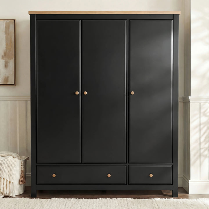 [Black] Haven wardrobe front lifestyle, painted doors with oak knobs beside panelled wall
