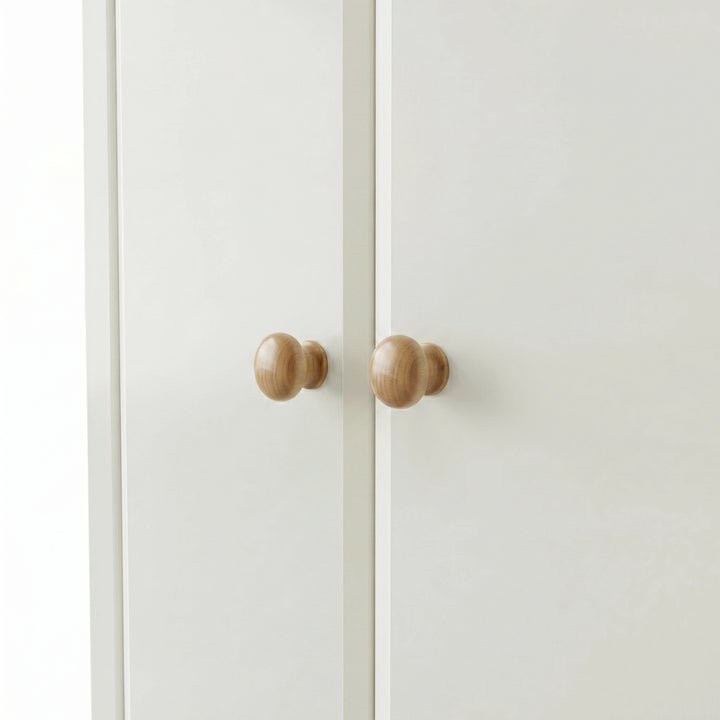 [White] Haven 3-door wardrobe close-up of two round solid oak wooden knob handles on painted doors