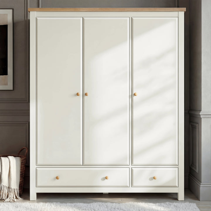 [White] Haven wardrobe lifestyle front view, panel doors and oak top in a calm grey bedroom corner