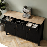 [Black] Haven 3-door sideboard with three top drawers open showing bottles, cutlery tray and folded linen inside