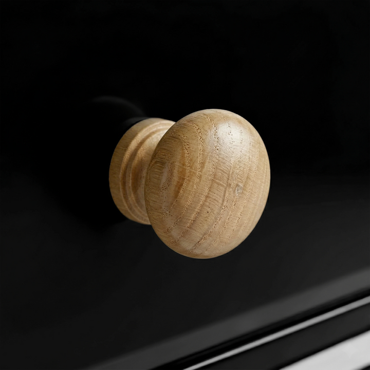 [Black] Haven 2-drawer bedside table close-up of a round solid oak wooden knob handle on a painted drawer front