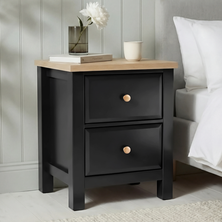 [Black] Haven 2-drawer bedside table main front view showing full painted frame, drawers and oak veneer top panel
