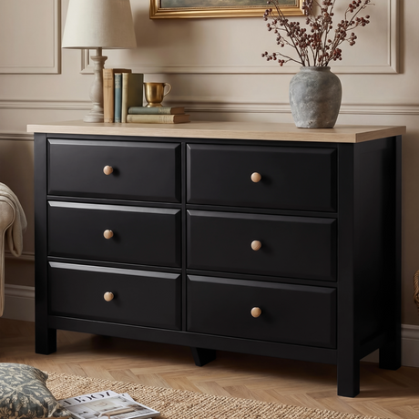 [Black] Haven 6-drawer chest front view in a styled room with lamp, vase and decorative objects on oak top