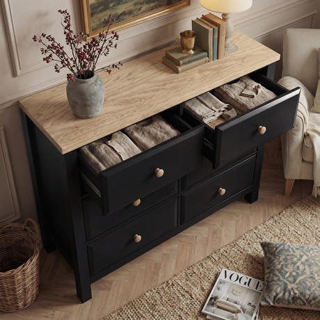 [Black] Haven chest of drawers with top drawer open showing interior storage depth and oak veneer top surface