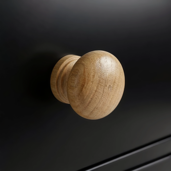 [Black] Haven 5-drawer tall chest close-up of a round solid oak wooden knob handle on a painted drawer front