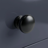 [Blue] Haven 3-drawer chest close-up of one square tapered painted leg meeting the floor on light wood planks