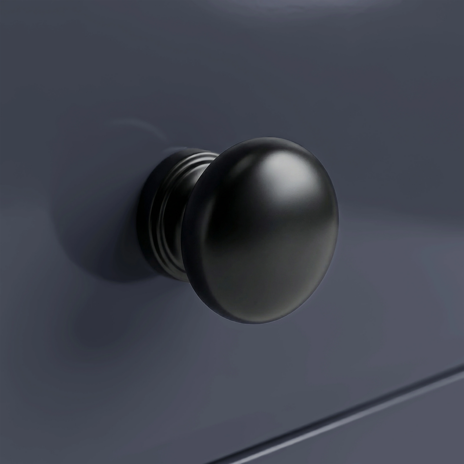 [Blue] Haven 3-drawer chest close-up of one square tapered painted leg meeting the floor on light wood planks