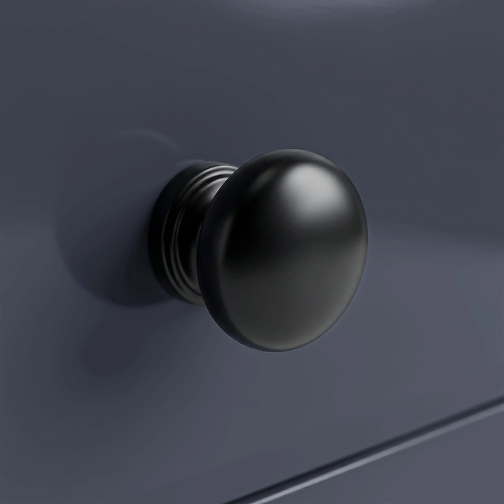 [Blue] Haven 3-drawer chest close-up of one square tapered painted leg meeting the floor on light wood planks