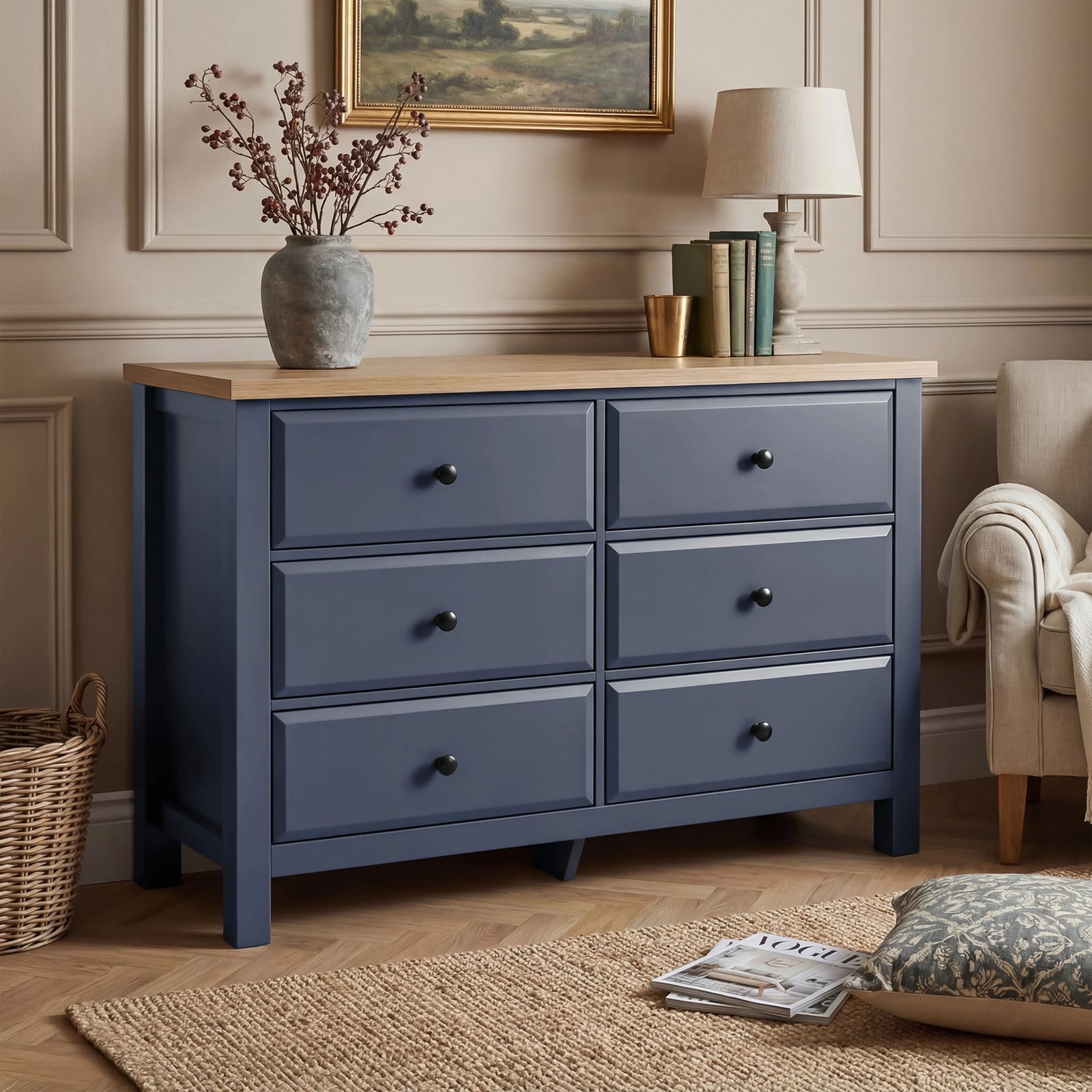 [Blue] Haven chest of drawers in a bedroom setting with artwork above and dried floral arrangement on oak top