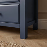 [Blue] [Blue] Haven 6-drawer chest base corner detail showing painted square leg and bottom drawer edge