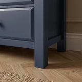 [Blue] [Blue] Haven 6-drawer chest base corner detail showing painted square leg and bottom drawer edge