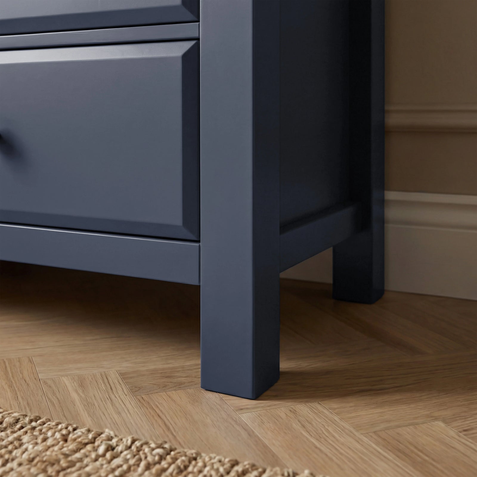 [Blue] [Blue] Haven 6-drawer chest base corner detail showing painted square leg and bottom drawer edge