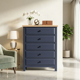 [Blue] Haven 5-drawer tall chest styled with white orchid, table lamp on left and pale green chair on marble floor