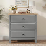 [Grey] Haven 3-drawer chest front view in a neutral styled room with decorative objects on oak veneer top