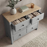 [Grey] Haven chest of drawers with multiple drawers open showing interior storage depth and oak veneer top
