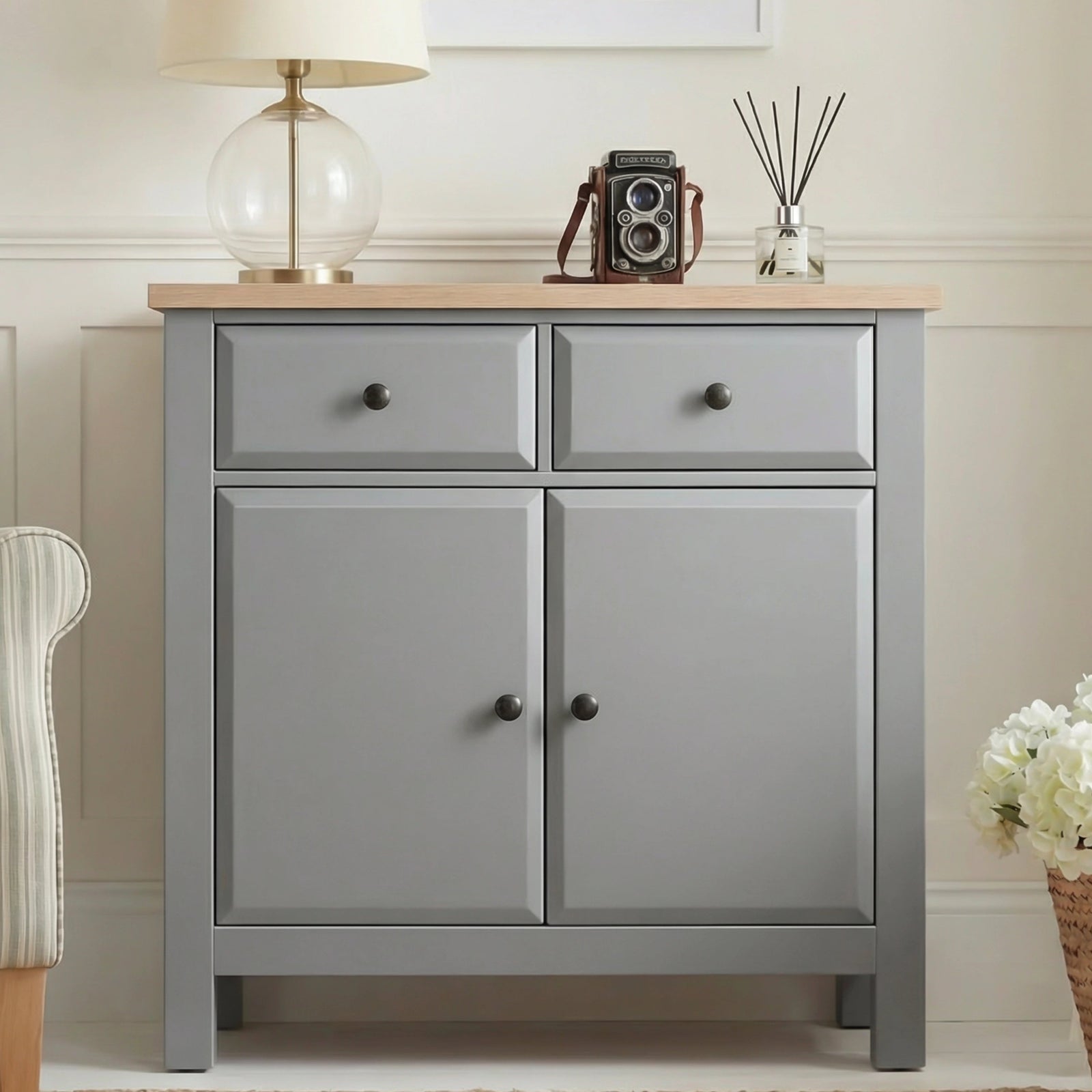 [Grey] Haven 80cm sideboard front view in a styled room with decorative objects arranged on oak veneer top