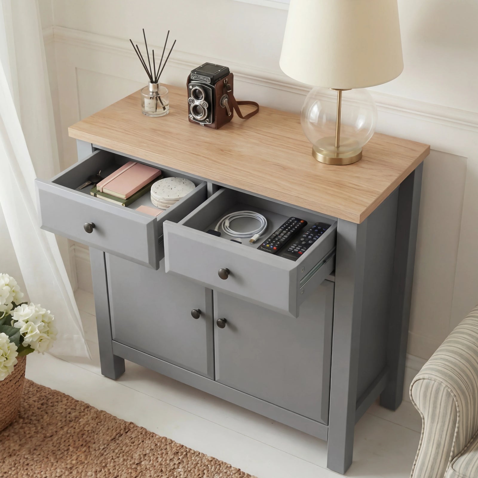 [Grey] Haven grey sideboard with both top drawers pulled open showing contents and oak veneer top surface