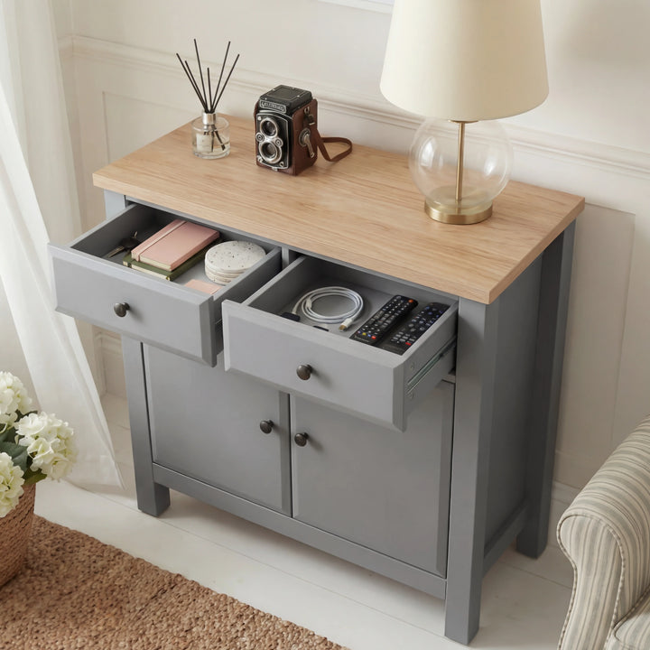 [Grey] Haven grey sideboard with both top drawers pulled open showing contents and oak veneer top surface