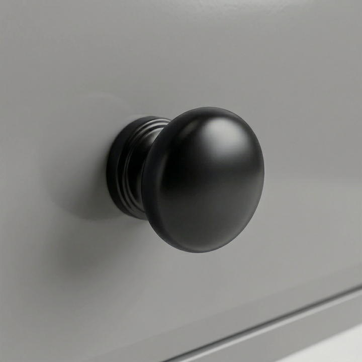 [Grey] Detail single round black knob fixed to a grey painted drawer of Haven tall chest of drawers