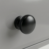 [Grey] Detail single round black knob fixed to a grey painted drawer of Haven tall chest of drawers