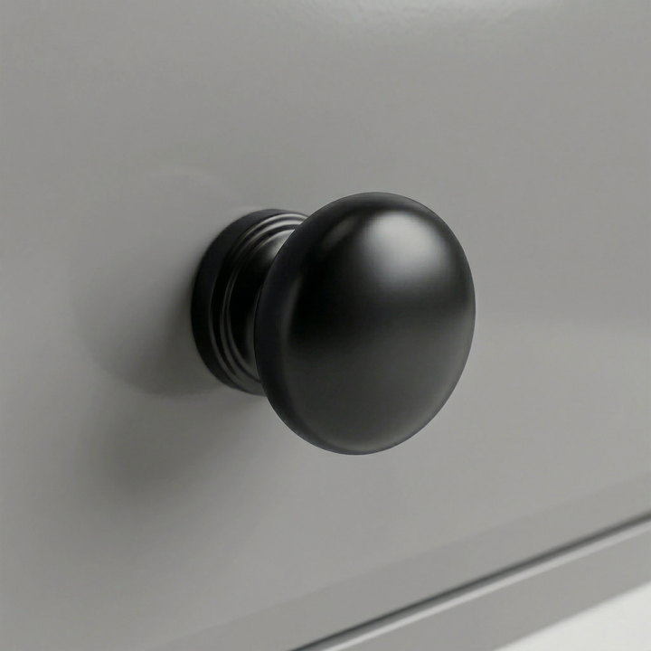 [Grey] Detail single round black knob fixed to a grey painted drawer of Haven tall chest of drawers