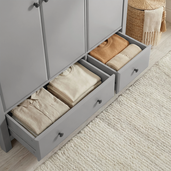 [Grey] Haven wardrobe close view of two open base drawers stacked with neutral folded clothes on rug