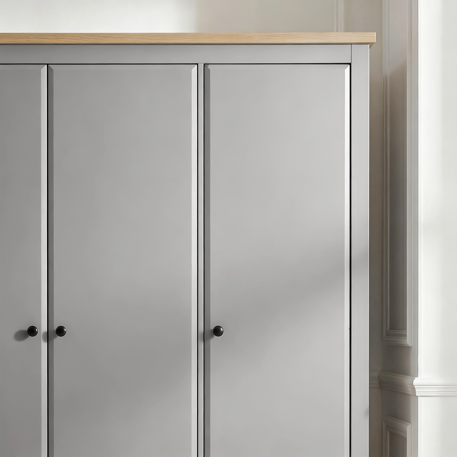 [Grey] Haven 3-door wardrobe angled close-up of top right corner showing oak veneer top panel and door frame