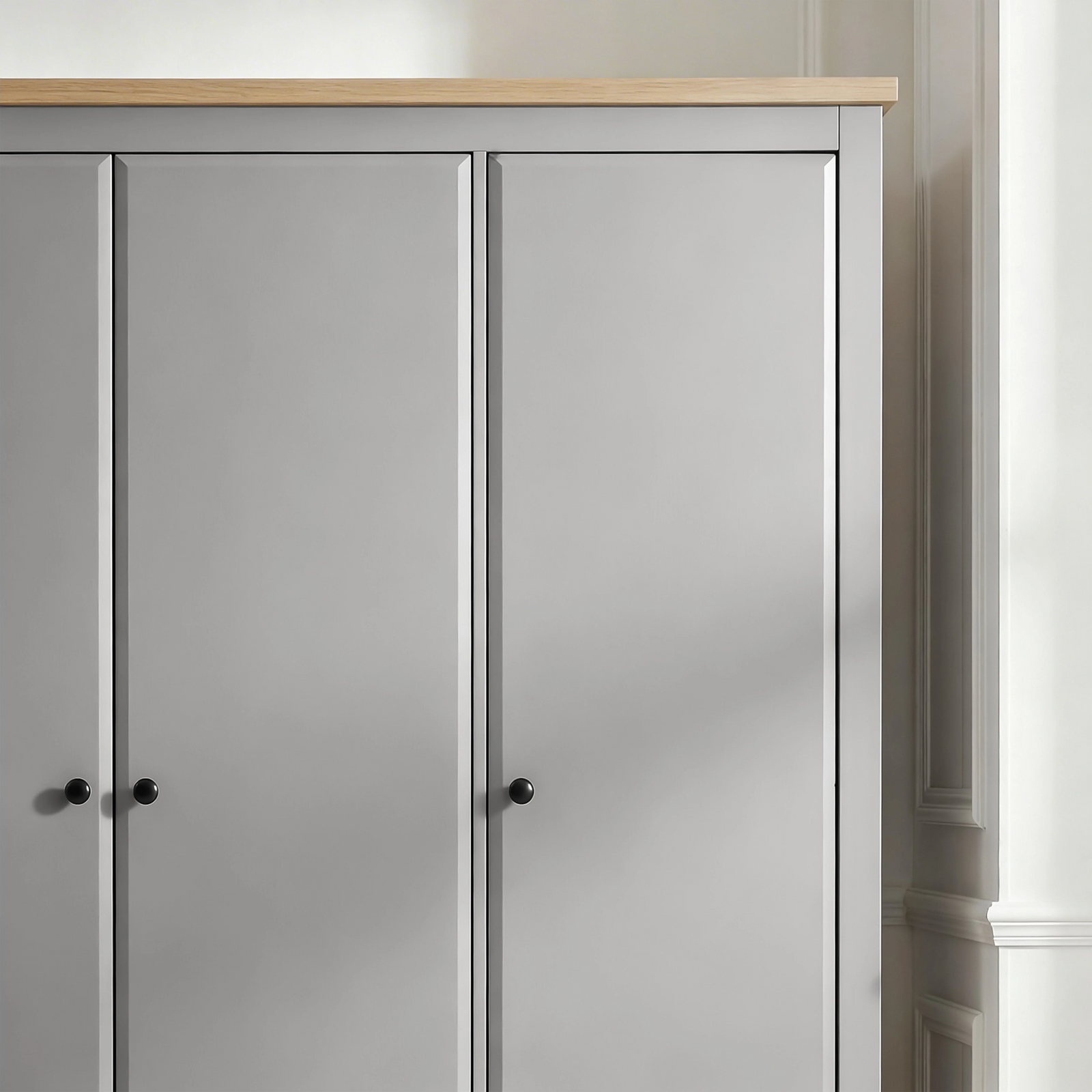 [Grey] Haven 3-door wardrobe angled close-up of top right corner showing oak veneer top panel and door frame