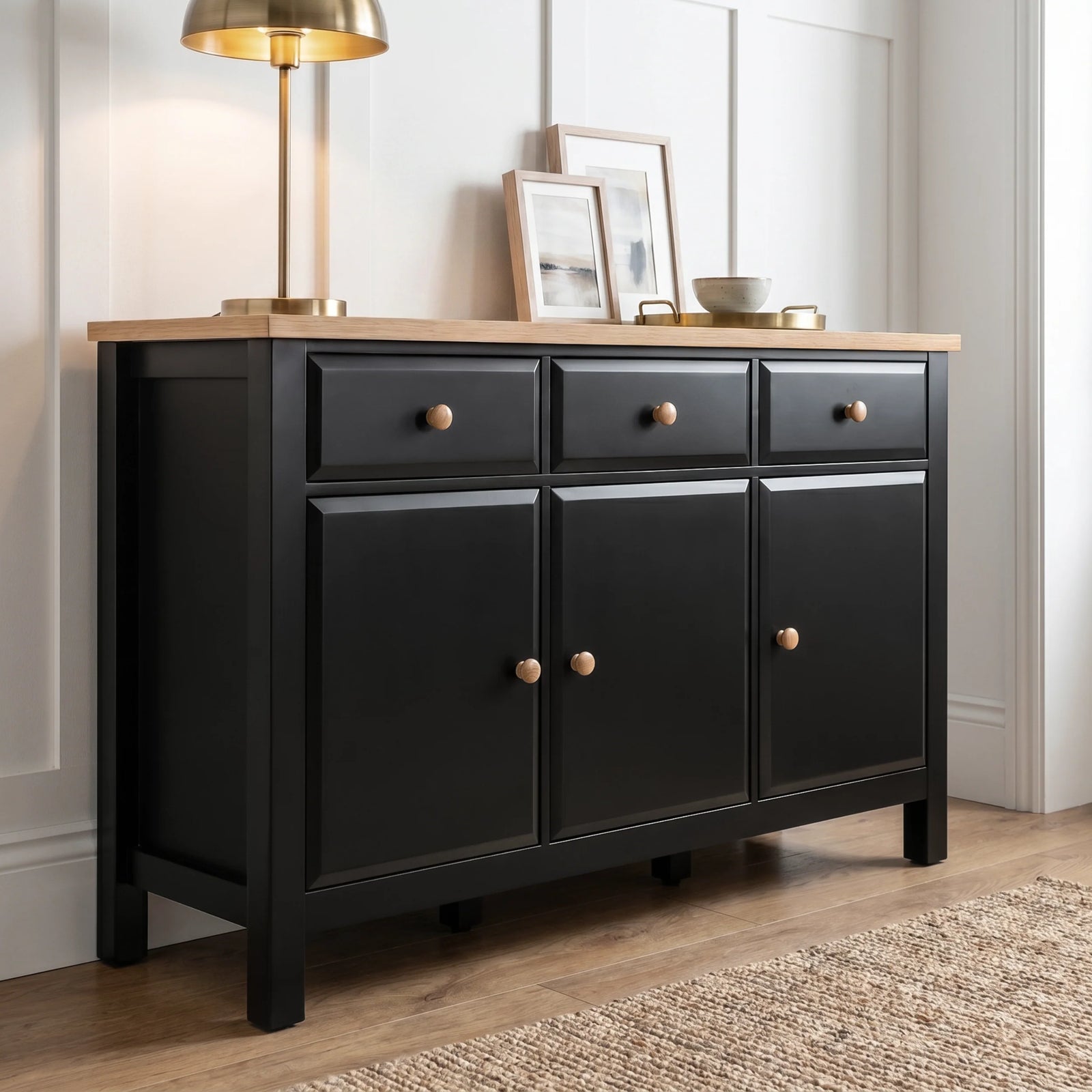 [Black] Haven Large Black Sideboard with Drawers & Oak Top, Painted Finish shown from an elegant low angle.