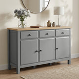 [Grey] Haven Large Black Sideboard with Drawers & Oak Top shown from a low angle in a living room.