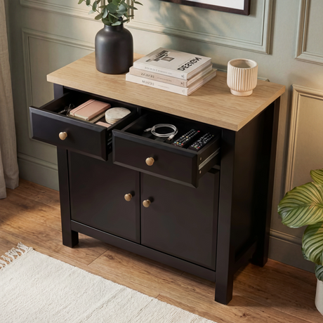 [Black] Haven sideboard with one top drawer open revealing contents, 2 closed doors below and oak top styled