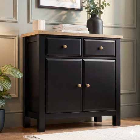 [Black] Haven sideboard angled front with oak top, 2 drawers and 2 doors with round knobs, styled books and vase