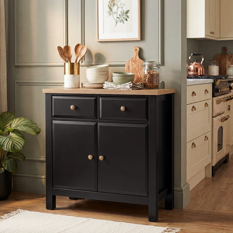 [Black] Haven sideboard front-angle kitchen scene with framed art, oak top styled, 2 drawers and 2 doors closed
