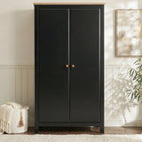 [Black] Side-angle Haven wardrobe, painted black body, oak veneer top proud of the frame at the edge.