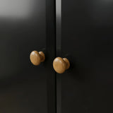 [Black] Pair of round oak knobs on the Haven 2 door wardrobe where the two black doors meet.