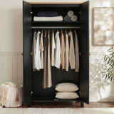 [Black] Haven wardrobe doors open, black interior with rail of shirts and folded linens on shelf above.