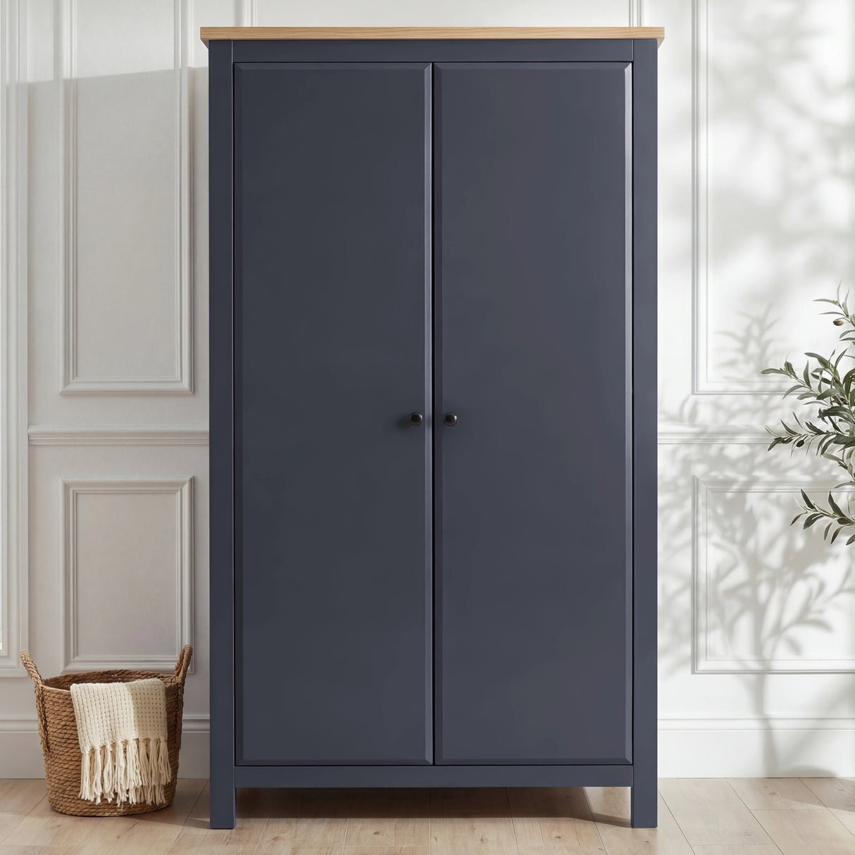[Blue] Haven wardrobe shown front-on, blue painted doors, warm oak top and raised tapered leg stance