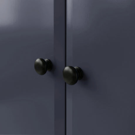 [Blue] Haven wardrobe knob close-up, two round black knobs on smooth blue painted door fronts