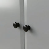 [Grey] Haven wardrobe knob close up, two round black wooden knobs on smooth grey painted doors