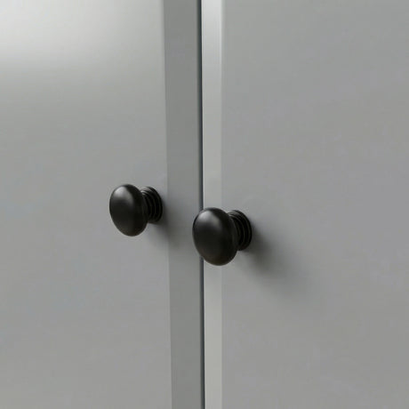 [Grey] Haven wardrobe knob close up, two round black wooden knobs on smooth grey painted doors
