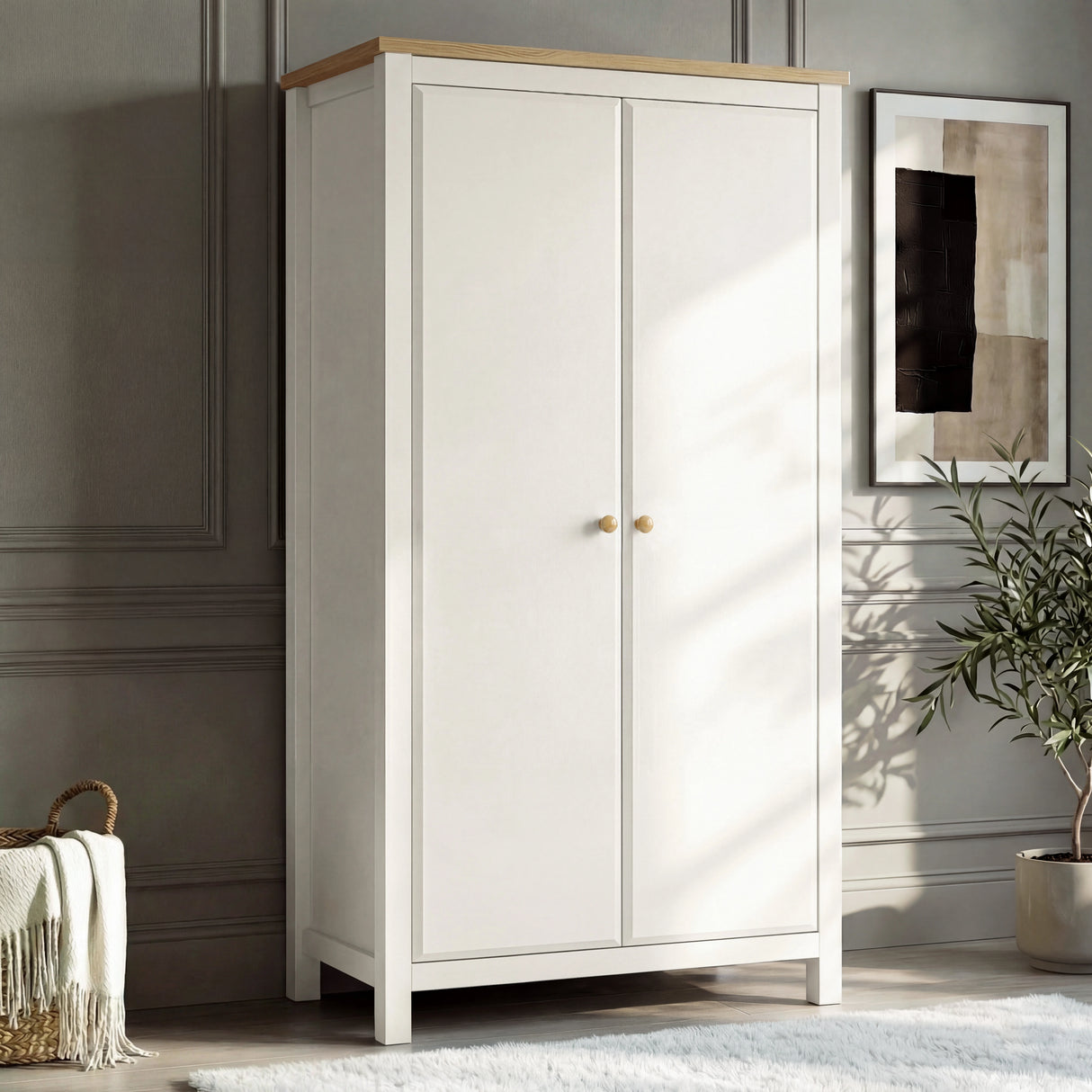 [White] Haven 2 door wardrobe angled, white painted frame with oak top and round oak knobs beside a wicker basket