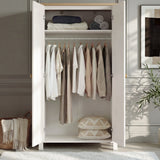 [White] Haven 2 door wardrobe open showing a full width hanging rail with clothes and a top shelf with folded items