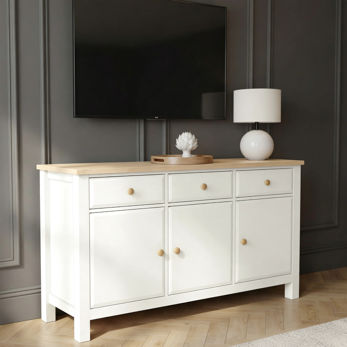 [White] Haven 3-door sideboard in a bedroom lifestyle setting with soft furnishings and accessories on oak top
