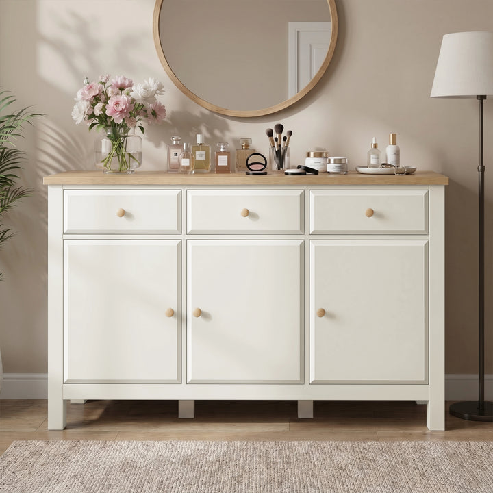 [White] sideboard with wooden top in a room setting with decor items