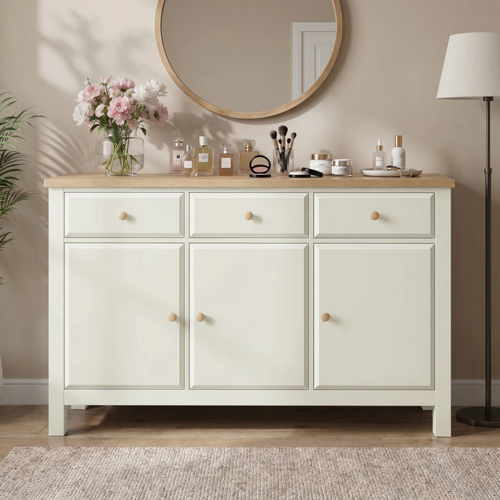 [White] sideboard with wooden top in a room setting with decor items