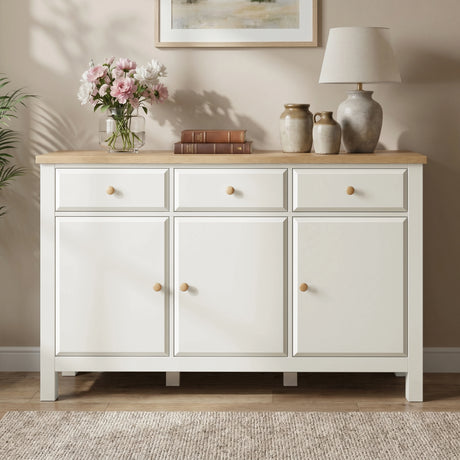 [White] Haven 3-door sideboard front view in a styled room with decorative accessories on oak veneer top