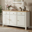 [White] sideboard with wooden top in a room setting with decor items