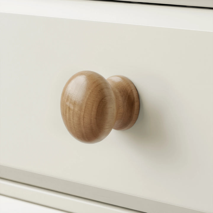 [White] Haven chest of drawers close-up of a single round solid wood knob handle on a painted drawer front